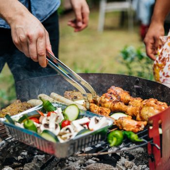 close up of man grilling food