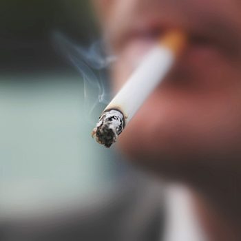 close up of cigarette in man's mouth