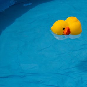 yellow duck floating in a swimming pool