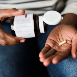 Woman taking pills for her health