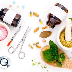 Herbal medicine VS Chemical medicine the alternative healthy care on white background.