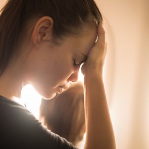 woman tired headache airplane flight flying