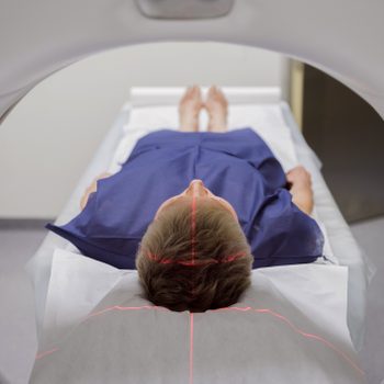 person laying in medical machine getting a brain scan