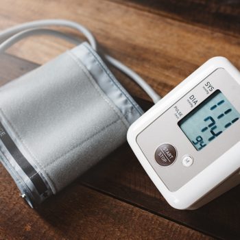 blood pressure machine on wood table