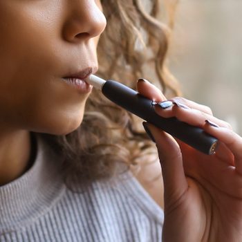 close up of young woman Vaping