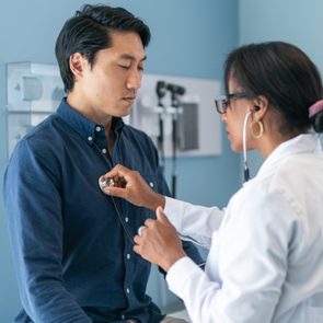 Korean man in consultation with doctor