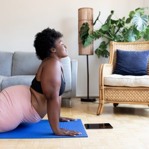 Woman doing yoga exercise at home