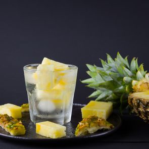 pineapple infused water on dark background